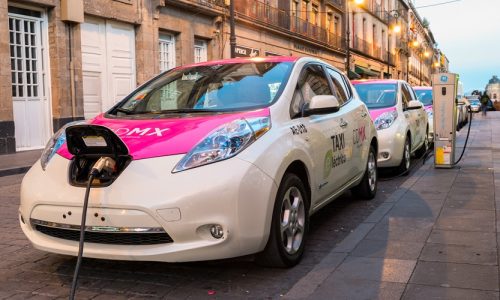 Mexico City, Mexico - January 11, 2016: Electric Nissan Leaf taxis are being charged at a charging station in downtown Mexico City, Mexico.